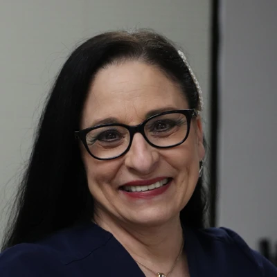 A headshot photo of Marlene, the office manager at Maan Chiropractic